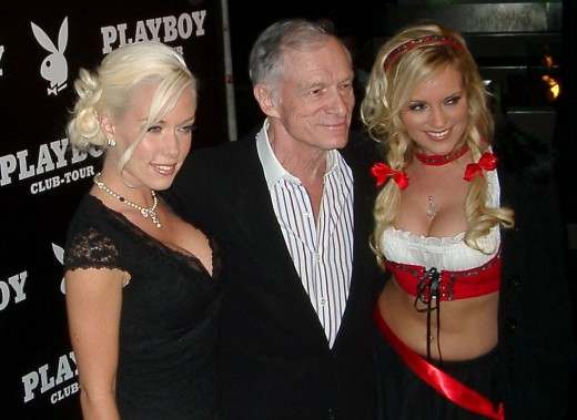 Hef with two of his girlfriends -- Kendra Wilkinson and Bridget Marquardt -- before he married model Crystal Harris in 2012.