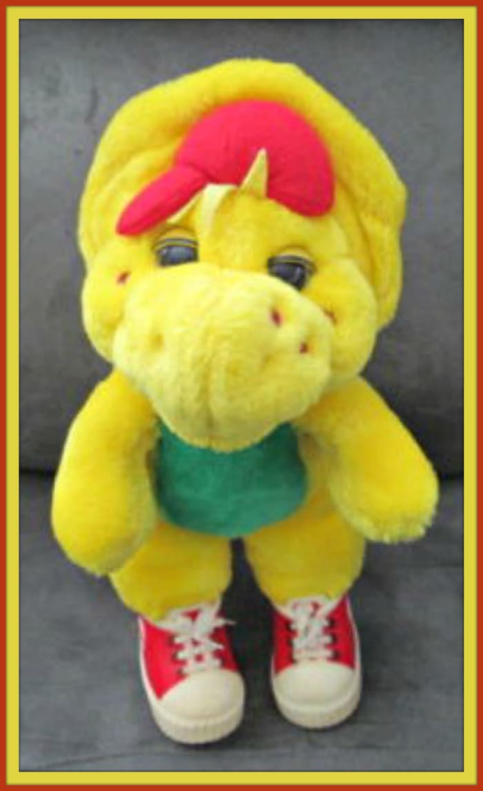 Here is a vintage 1994 Barney Character B. J. Plush 13 inches stuffed yellow dinosaur with his famous vinyl sneakers.
