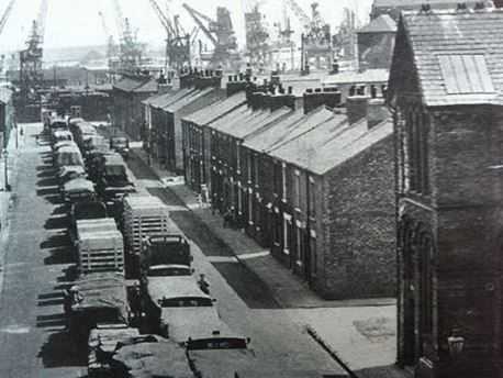 "There's a big ship in our back yard!" Near ground level, this is Lower East Street, where columns of commercial vehicles await their turn to access the warehouses with goods inward or outward