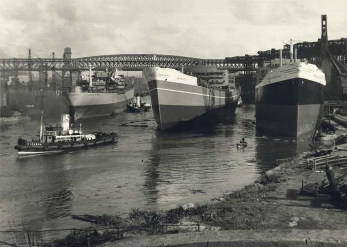 Three Sunderland-built ships await fitting-out after launch on the River Wear