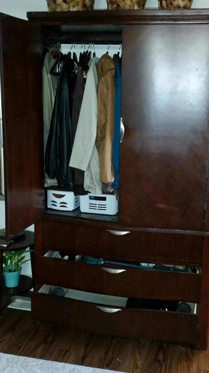 Add a clothes rod to the largest section of the unit. You can store mittens, mufflers and hats in the drawers. In this one, they keep exercise gear in the drawers.