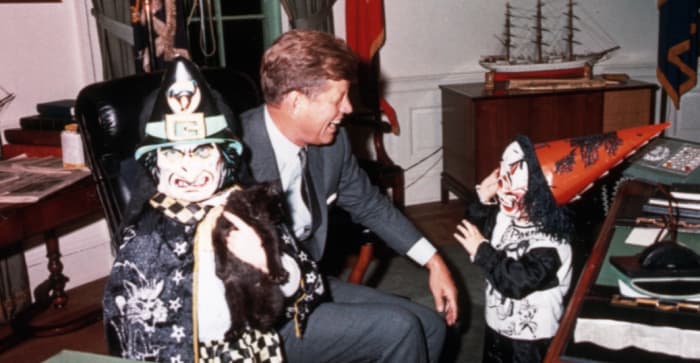 Former President John F. Kennedy with his children, John Jr. and Caroline at the White House. Everyone loves Halloween.