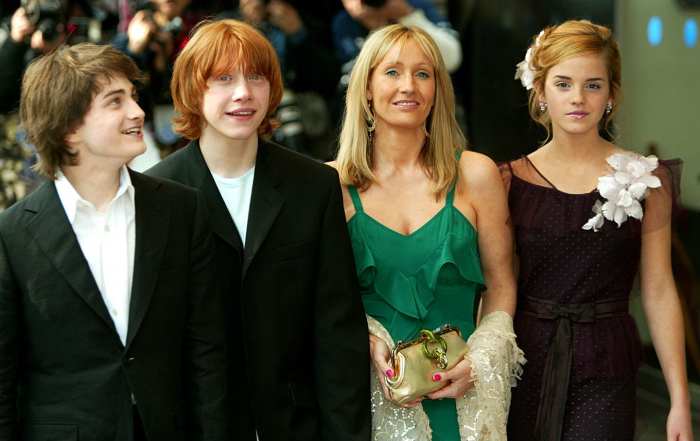 Daniel Radcliffe who played Harry Potter is on the far left. Next to him is Rupert Grint who played Ron Weasley. Emma Watson who played Hermione Granger is on the far right.