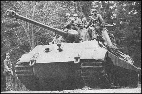 Paratroops lead the attack into Buchholz Belgium early in the Ardennes counter-offensive. With paratroops riding along on top of his tanks the town was taken without a shot fired by Kampfgruppe Peiper.