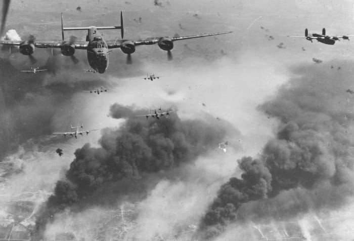 American 15th Air Force B-24s flying through flak and over the destruction created by preceding waves of bombers. Ploiești, Romania (1943). The raids on the Ploiesti oil fields took out Germany's last remaining source of oil.