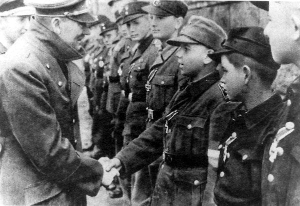 One of the last known pictures of Adolf Hitler taken during the Battle for Berlin May 1945. Hitler shaking the hands of the Hitler Youth some as young as twelve who battled the Red Army to the very gates of his bunker.