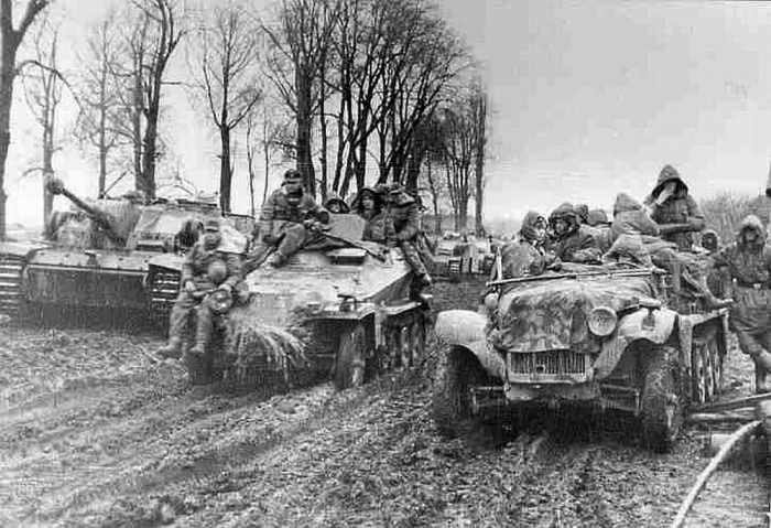 Peiper's combat group on the move in the mud and muck during the attack in the Ardennes.