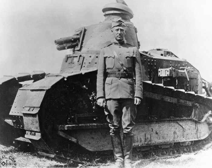 Patton at Bourg in France in 1918 with a Renault FT light tank. He was know in the First World War as a hard charging tank commander. He used his tanks as if it was a hores in the calavry.