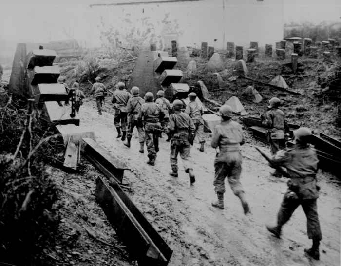 American troops pass through the dragon's teeth of the West Wall during the Battle for Aachen September 1944.