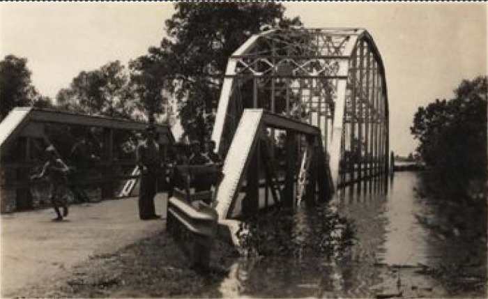 Poteau River Flood of 1943. The US-271 Poteau River bridge during the May 1943 flood. Note the high water line on the right girder of the thru truss bridge.