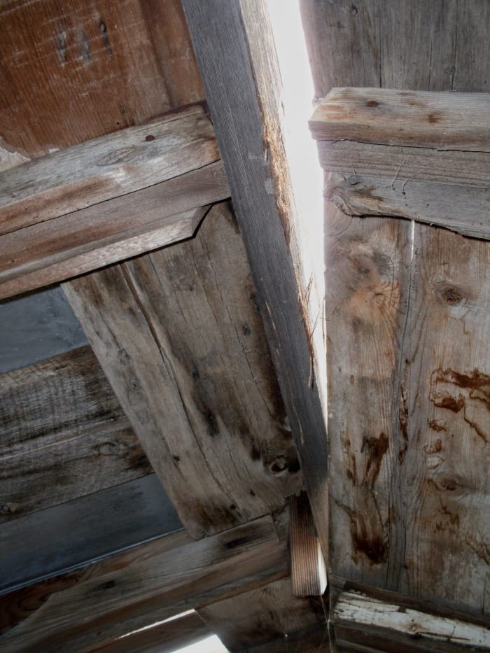 Some of the wood has been warped by torsion and exposure, but will still come right enough to make a good roof again.