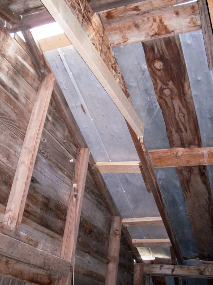 Roof sheets have been installed using 2-inch sheet metal screws. Ridge cap will come later, but for now the barn is serviceable for many uses.