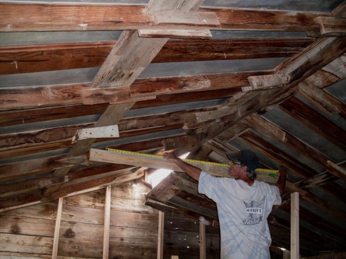 Take accurate measurements at crucial points along the structure. These include the length of the brace, from the top edge of the 2x6 to the peak, and at least one point along the slope, so you can mark accurate lines on your plywood or OSB board.