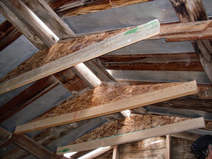 The main braces are finished, but further strategic bracing is needed. Also, there is some work to do to replace roof sheets and ridge cap, which has been torn.