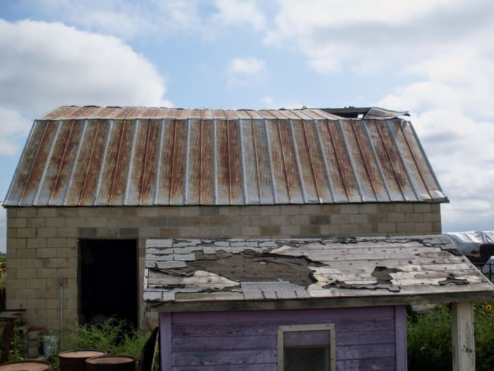There were 3 sheets hanging down inside the barn toward the front end. Each of these old sheets was 2 feet wide.