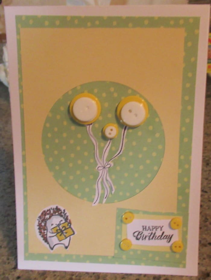 Paper and buttons from Crafter's Companion. Layer your buttons to create dimension and color