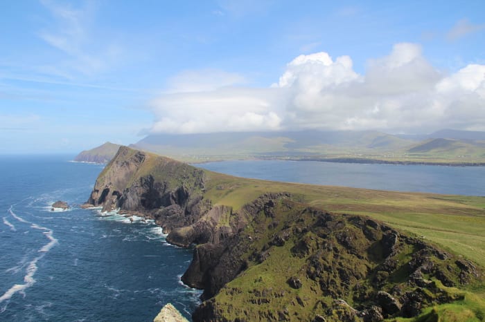 "An Triúr Deirféar" by Dáibhí Ó Bruadair ©2012. Smerwick can be seen in the gentle bay behind this majestic headland.