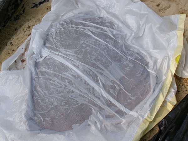 After all the concrete is smoothly applied, cover the top and sides with plastic to cure and dry for at least 24 hours.