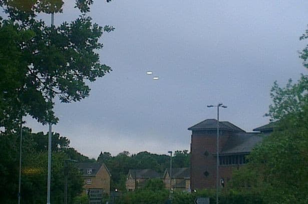 Steve Lambert caught these two UFOs on camera hovering over the skies of Bracknell, Berkshire, on the night of Friday 14 June, 2013. "They were heading south-west at high speed towards Basingstoke - quicker than any normal aircraft.