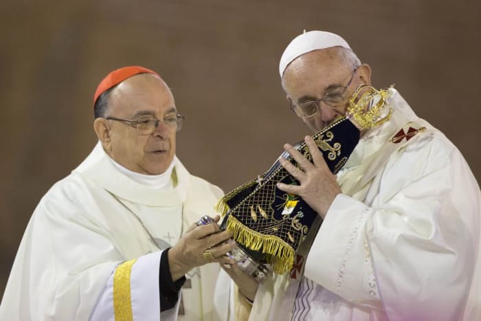 Pope Francis kissing an image of the Virgin of Aparecida, a black Mary at the World Youth Day Mass July 2013.