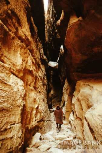 High in the cliffs above the Dogon village where we see the brother of the Hogon walking between the rocks to assist with a burial, Bandiagara Escarpment, Mali- 1994