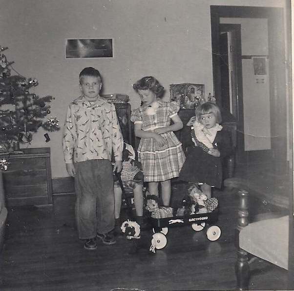 Here I am with all my siblings with our homemade gifts. What a happy Christmas we had. Mom made me a new dress and some stuffed toys for my sisters.