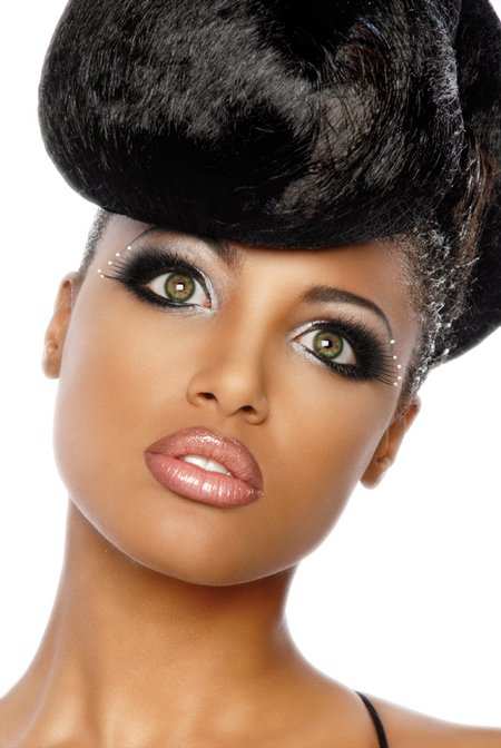 Victoria's Secret model KD Aubert has green eyes with a chestnut star-burst. If she looks this beautiful with green eyes on her lovely black skin then you can pull them off too.
