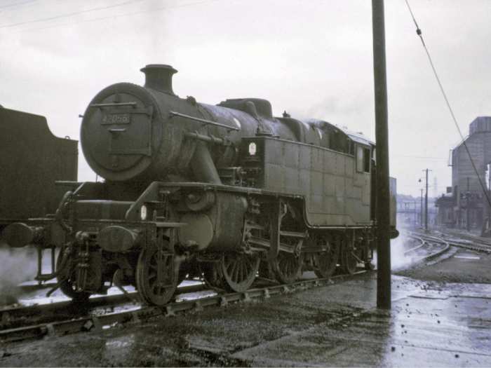 42055 stands in the rain at Low Moor shed near Bradford. An atmospheric shot of a redoubtable locomotive