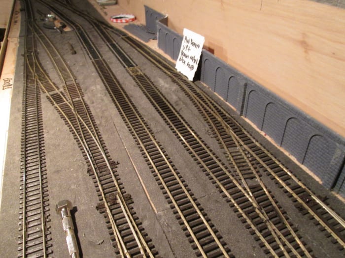 Unit 5 trackwork has been rationalised, the (defective) three way and single slip have been lifted to make way for medium radius left and right-hand points respectively, access to the Down Main still possible for the banker