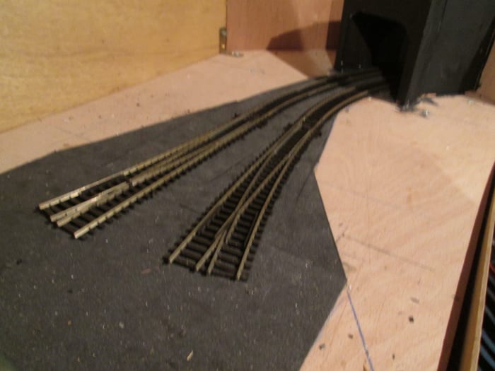 Unit 7 fiddleyard 'throat' with the first points in place to show where tracks will fan out from the 6 ply board built baffle (how's that for alliteration) towards the cellar stair end.