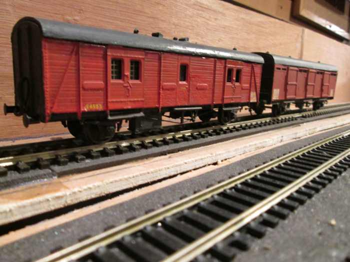 A Southern Region GUV (utility van) in early BR livery, and an ex-LNER CCT (covered carriage truck) on parcels duty by this time.(Parkside kits)