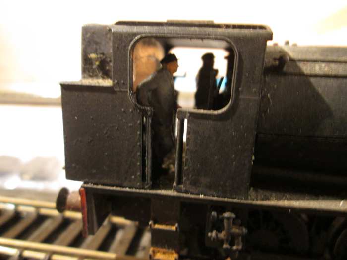 68010 close-up with fireman resting after topping up the grate, driver - far side - makes adjustments