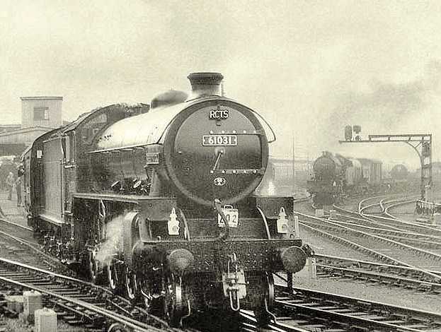 Class B1 4-6-0 61031 'Reedbuck' brings a Railway Correspondence & Travel Society (RCTS) special around York station in the 1960s - one of the platforms added to cope with wartime traffic. A goods working awaits the 'right away' from the goods yards