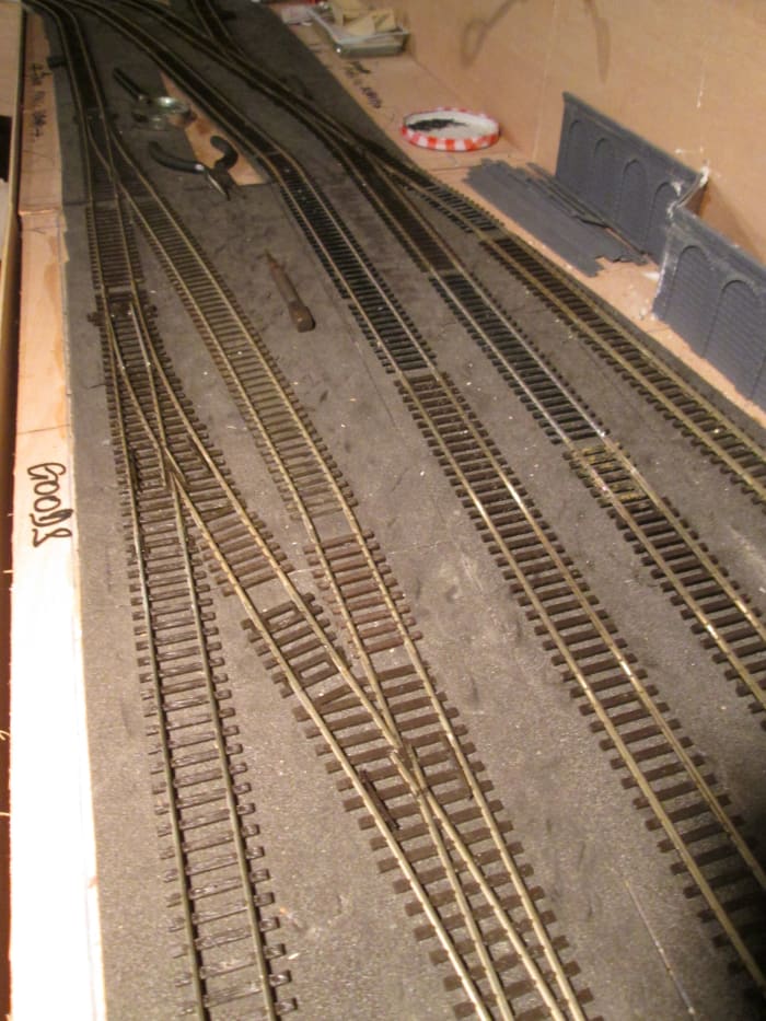 Further along, the double slip has made way for a pair of left-hand points, a 'loop' created for locos to pass in the yard if necessary. Spare sleepers to fill gaps.