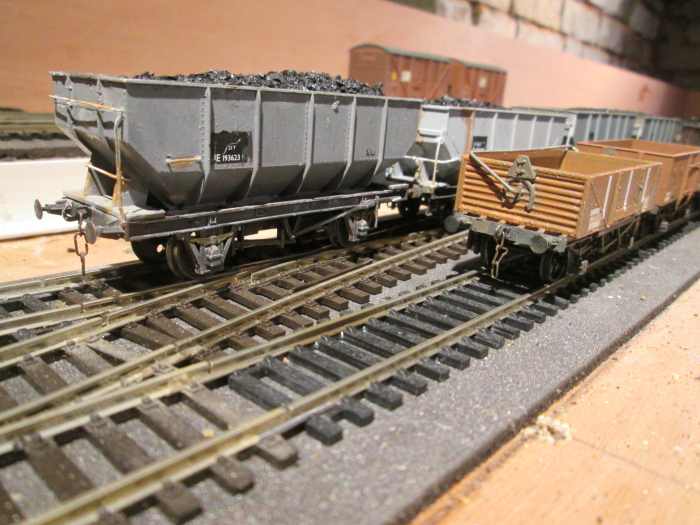 Leading wagons,, ex-LNER steel mineral hopper (modified Dapol), and a Parkside BR 'shocwagon' for fragile consignments - the Dapol hopper wagon is a subject of ROPFAMR - 32 "Convert a Proprietary Hopper... " Behind it is the Parkside Dgm 1/146 hoppe