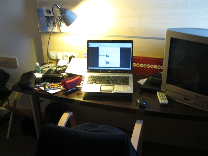 Desk in hotel room where I edited and published this before dawn in Barcelona while my wife slept a few feet away.