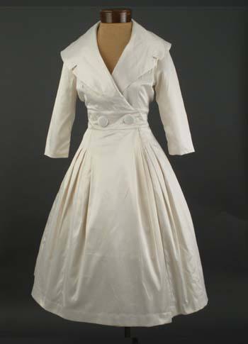 Stunning "Courtney" coat/dress from Trashy Diva Clothing, recreated for their Bridal Collection in a lustrous antique white satin finish cotton.