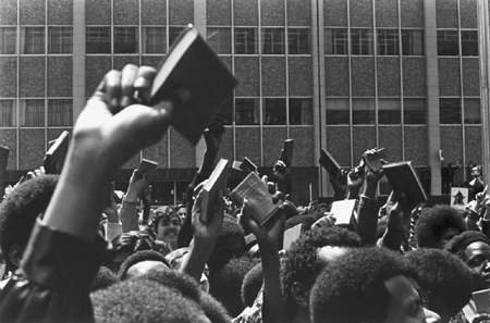 BLACK AMERICAN CITIZENS PROTEST THE WAR IN VIETNAM WAVING LITTLE RED BOOK OF CHAIRMAN MAO (WHO KILLED 50 MILLION HUMAN BEINGS)