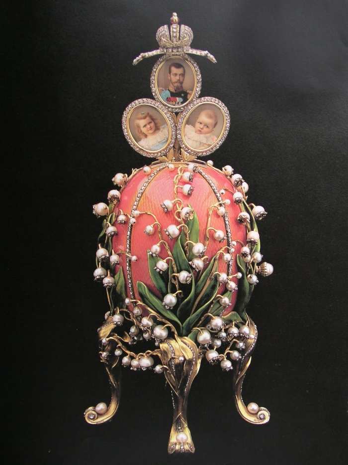 Emperor Nicholas II also presented this Lilies of the Valley egg to his wife in a style she loved with the flower that was her favorite. The 'surprise' inside was a trio of family photographs.
