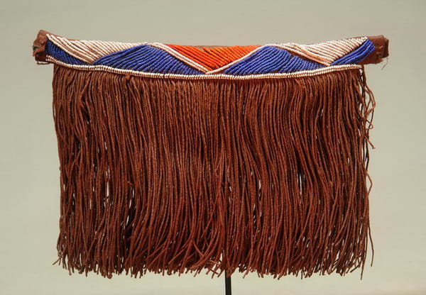 Pedi Apron which is worn as front panels called "Gabi". These aprons are mede from leather, plant fiber and glass beads