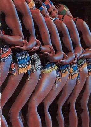 Zulu Girls wearing beaded bands on the forehead, and wearing short beaded skirts performing the Nguni people's Snake dance