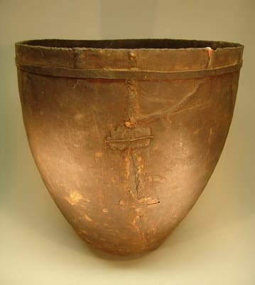Basotho Brewery Vessel("Eqho"). This particular example was copper pegged at two points, then sealed with hornets wax. An iron band was cut and attached to its neck for added strength