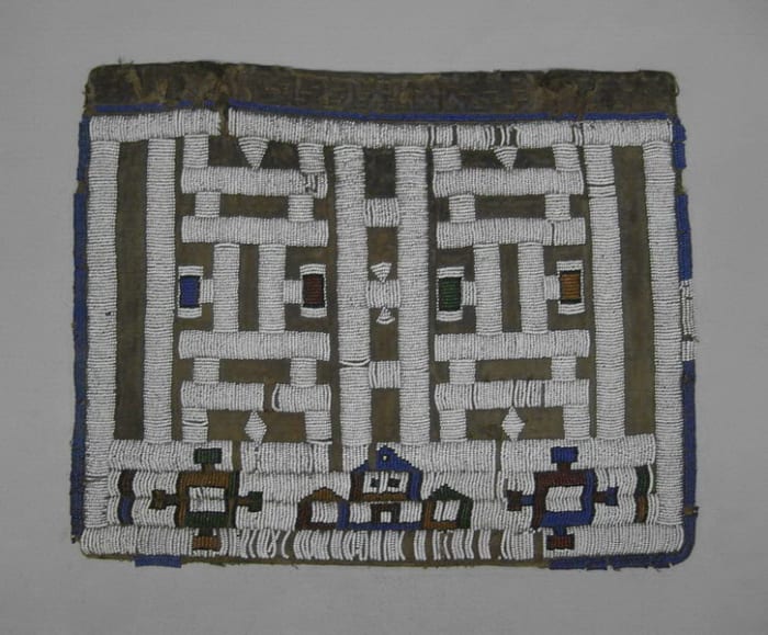 Ndebele Apron called "Pepetu", which a small beaded apron worn by a young ndebele maiden after completing a period of seclusion. These ries represent female initiation
