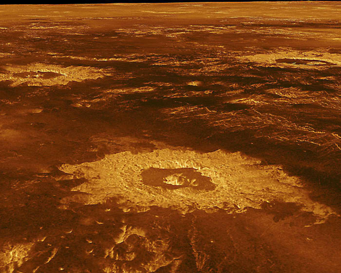Lavinia Planitia - one of the great plains of Venus - covers a 2000 km diameter region in the southern hemisphere. In the foreground is Howe Crater 37 km (23 miles) in diameter. Also in view are the craters Danilova (left) and Aglaonice (right)