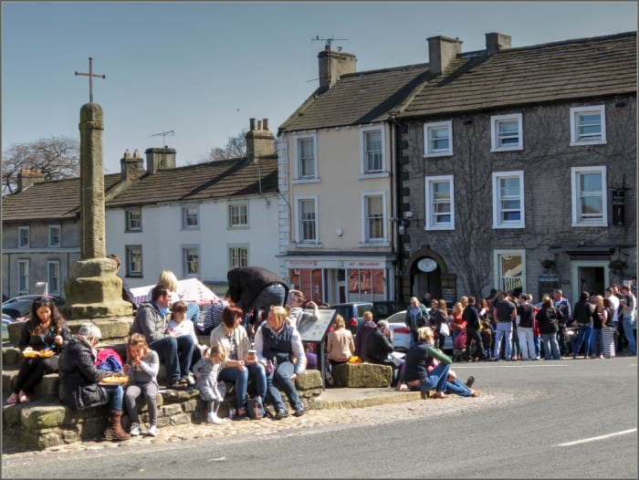 The Market square, and visitors flock in the sunshine - there are several hotels, pubs and coffee shops to keep them happy should the weather turn, which is always on the cards!