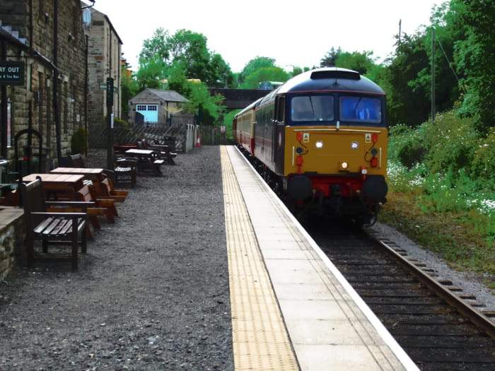 Leyburn Station, Wensleydale Railway Heritage Diesel 'Poseidon' draws to a halt with WR stock heading east. The WR has almost completed its passing loop here; trains to Redmire can pass those to Leeming Bar - more trains on the line!