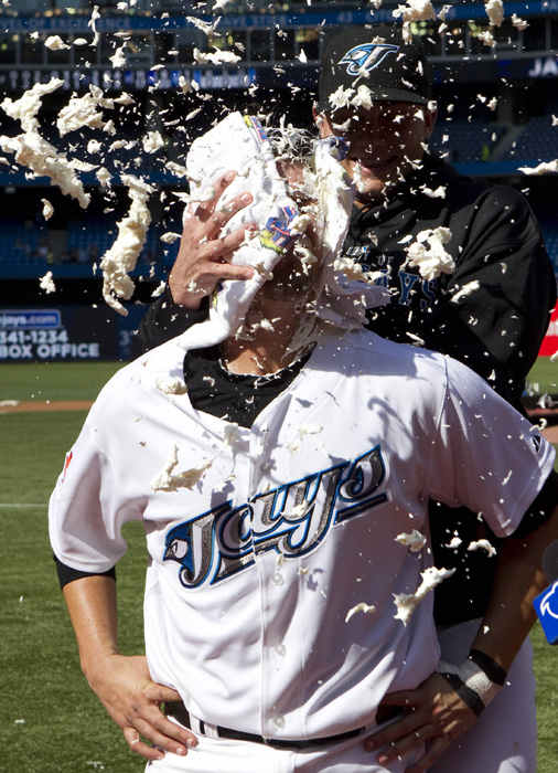On August 7, 2010, Toronto Blue Jays J.P. Arencibia gets a celebratory shaving cream pie in the face after opening night Blue Jays win. It was Arencibia's first major league appearance.