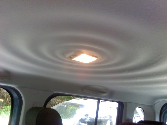 I would assume that the "ripples in water" pattern on the interior ceiling is supposed to exude a feeling of inner calm ... or something.