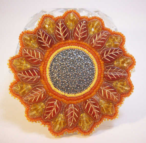 This is actually example of bead embroidery. You can still create stunning pieces without using the bead holes.