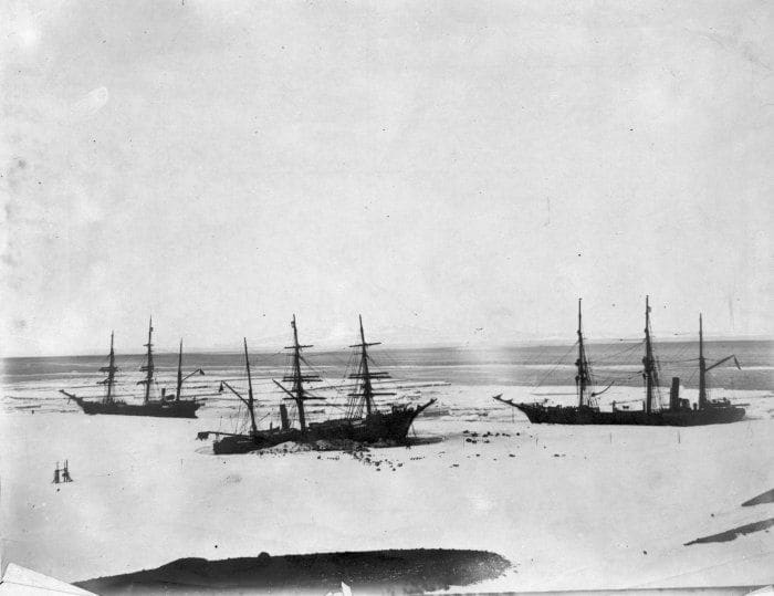 Discovery (centre) trapped by the ice in McMurdo Sound, accompanied by Morning (left) and Terra Nova (right) in February, 1904.